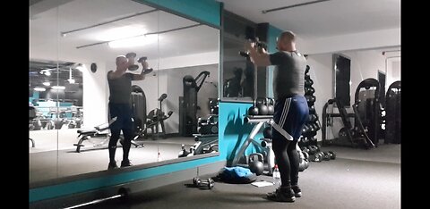 Dumbbells shoulders front raise . Gym..1st Feb 2023