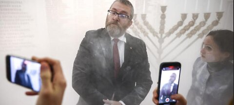 BREAKING: Polish MP Grzegorz Braun puts out Hanukkah candles with a fire extinguisher