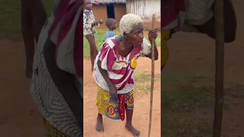 Remote Liberian coastal village, a granny cane-walk her way to be a part of the community discussion