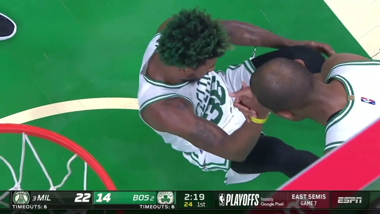 Marcus Smart takes a hard fall on his face as he collides with a driving Giannis