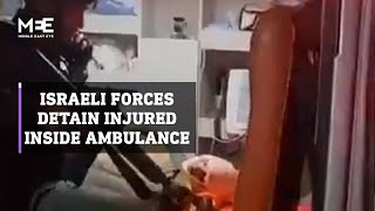 Israeli forces detain an injured Palestinian inside an ambulance in the West Bank