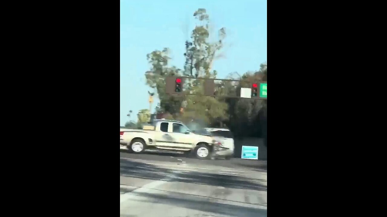 Woman runs from a hit and run, runs a red light and Karma smacks her hard