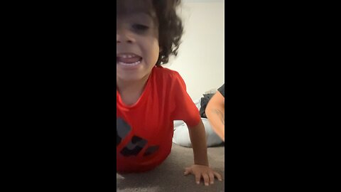 Teaching him how to do push ups