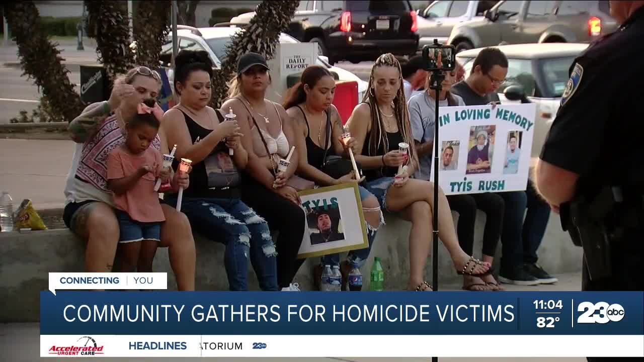 Community members gather at the Liberty Bell to honor homicide victims