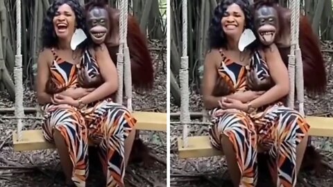 The orangutan hugs her and gives her love