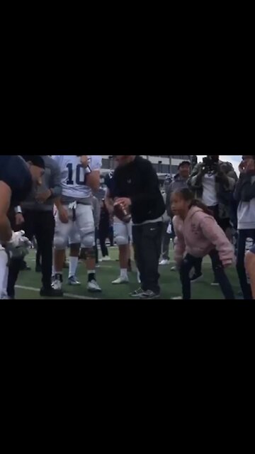 Little girl shows University Of Nevada football players how it's done