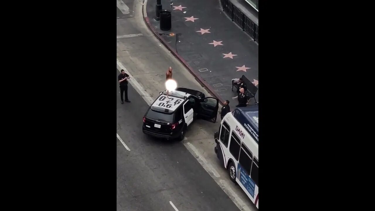 Man dances atop LAPD cruiser. #shorts