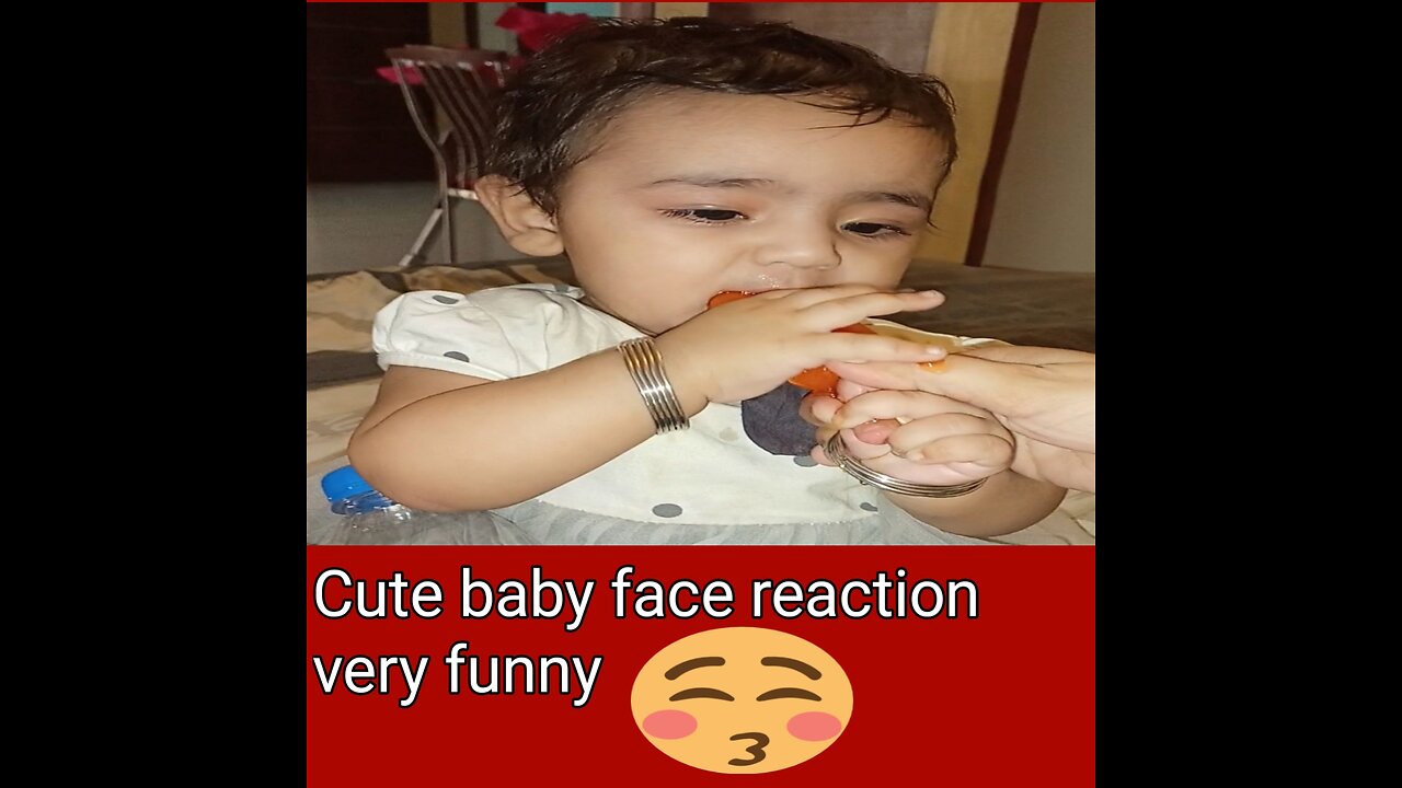 Baby reaction eating first time orange baar