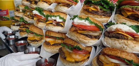 a burger with bacon and cheese made in the style of New York