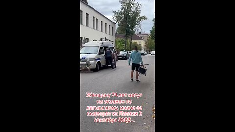 A 74 year old woman is carried to the Latvian language exam, if she fails she will lose residence