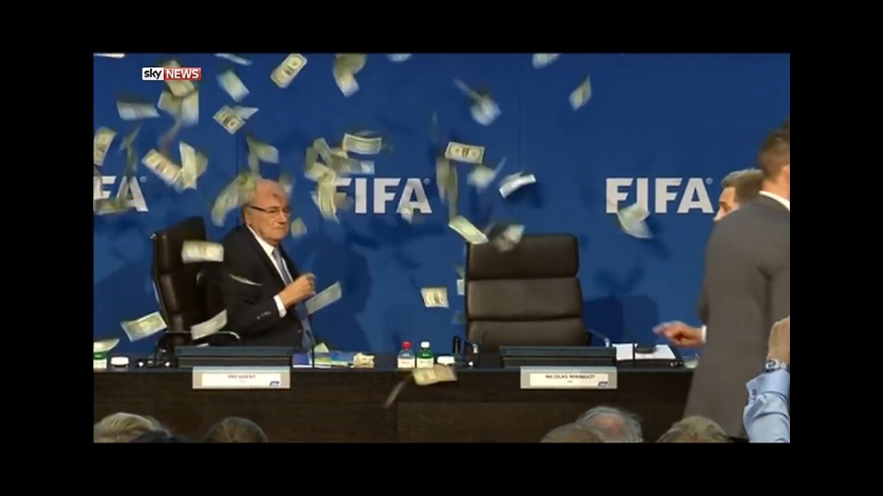 Sepp blatter has money thrown at him by lee