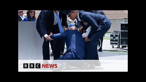 US President Biden trips and falls over at graduation event – BBC News