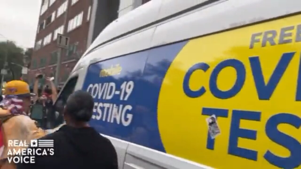 Covid testing van vs protestors