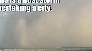 Dust storm overtakes a city