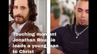 Jonathan Roumie leads a young man to Christ