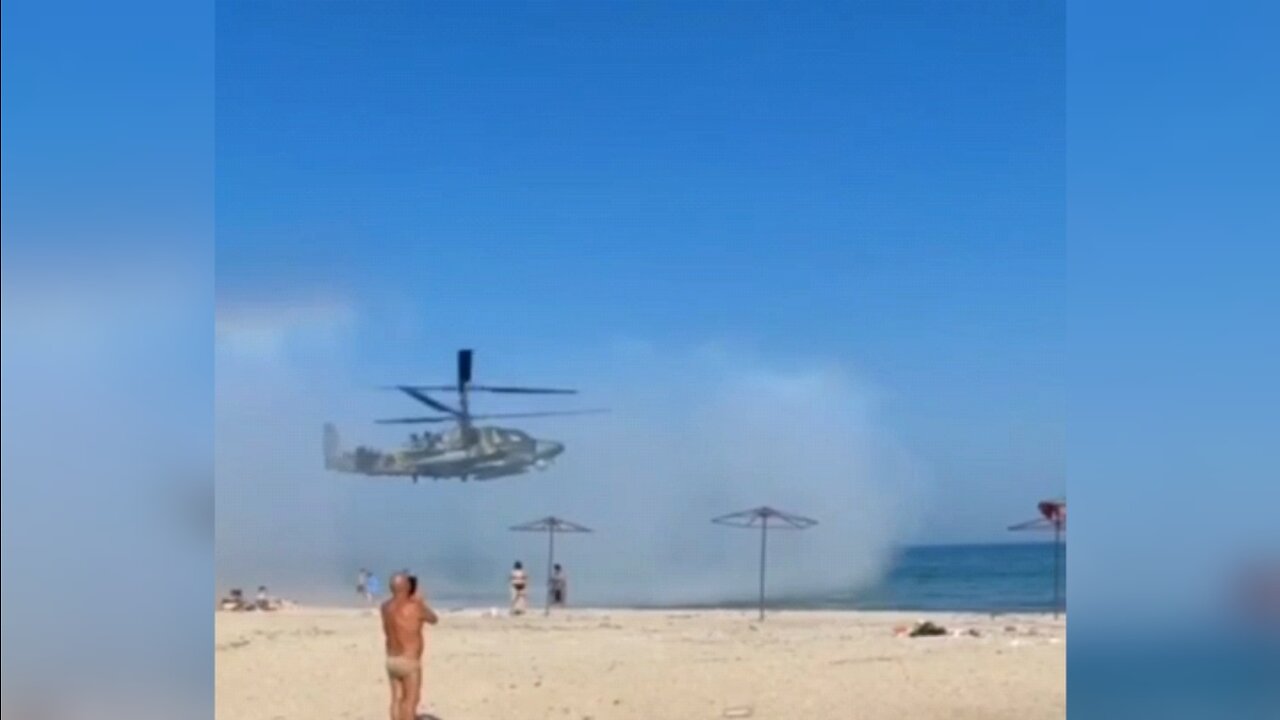 A Russian Ka-52 Aligator acting as a mist machine at a beach in Crimea!