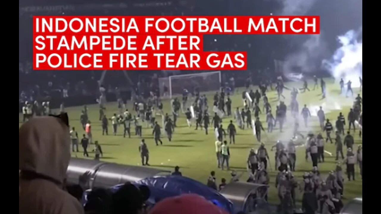 Indonesian football match stampede: At least 125 dead after fans storm pitch, police fire tear gas