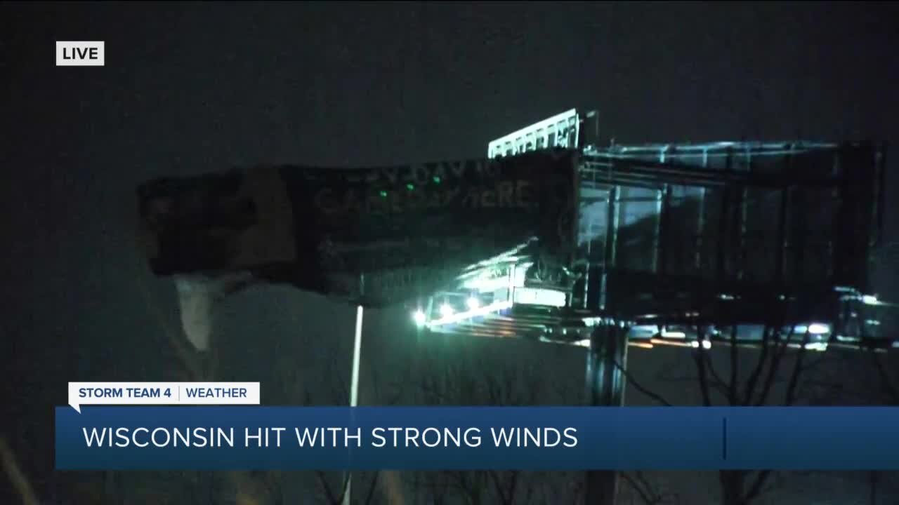 Wind tears advertisement from billboard on I-43 in Milwaukee