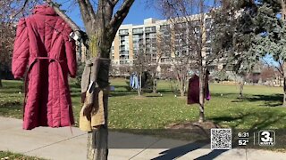 Secret Kindness Agents fill Turner Park with free warm clothing items for those in need.