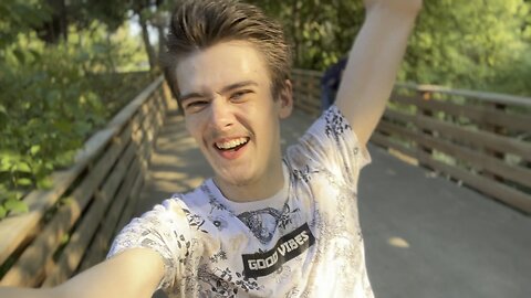 POV of Yung Alone Riding Long Board Down Hill At Riverfront