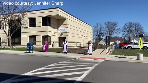 Priests recite prayer outside Barberton hospital for those on the frontlines of COVID-19 pandemic