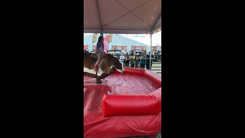 9 year old riding a Mechanical bull