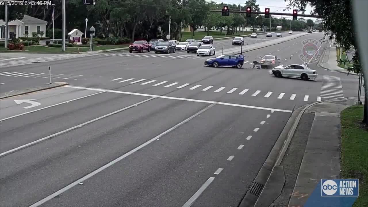 CAUGHT ON VIDEO: Driver zooms through red light, plows into two cars