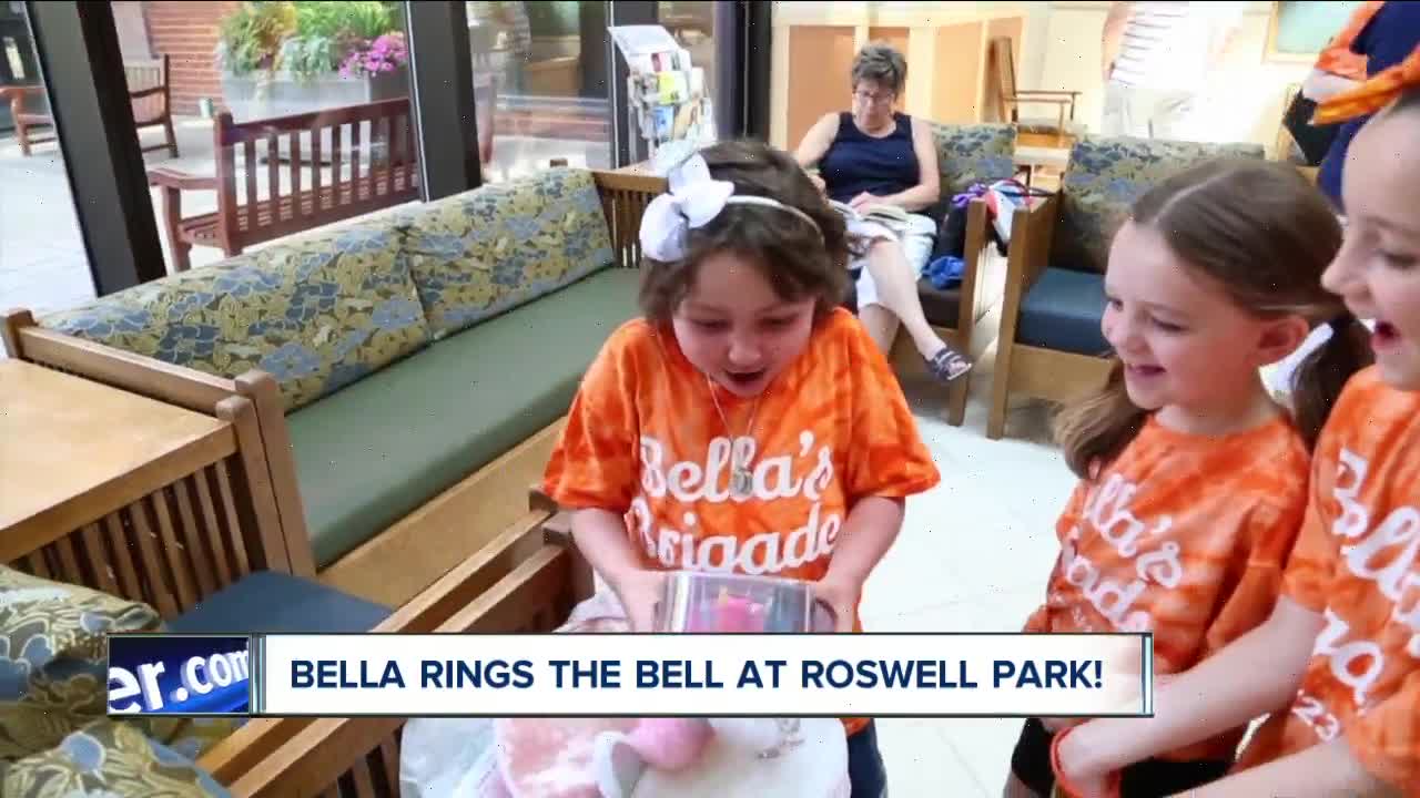 Isabella Phelan rings the victory bell at Roswell Park