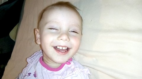The baby is tickled to Wake up