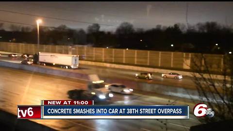 Driver narrowly escapes injury after a piece of concrete was tossed from an overpass and hit his windshield