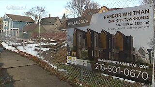 New rubber caps and signs along fencing go up at construction site, addressing neighborhood concerns