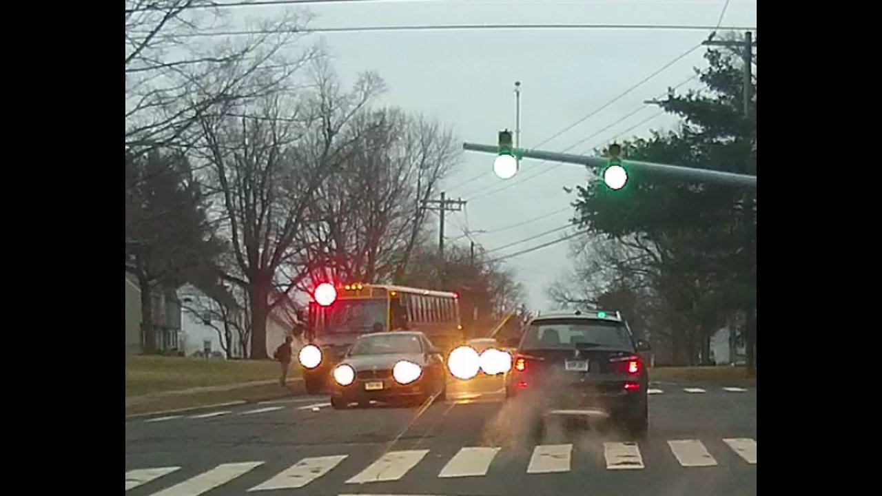 Impatient BMW Driver Passes Schoolbus flashing red lights