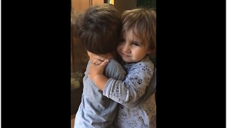 Precious little cousins can't stop hugging each other