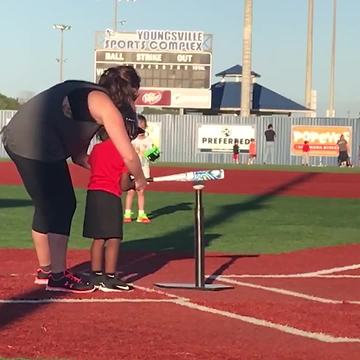 Little Boy Needs More Practice At Tee Ball