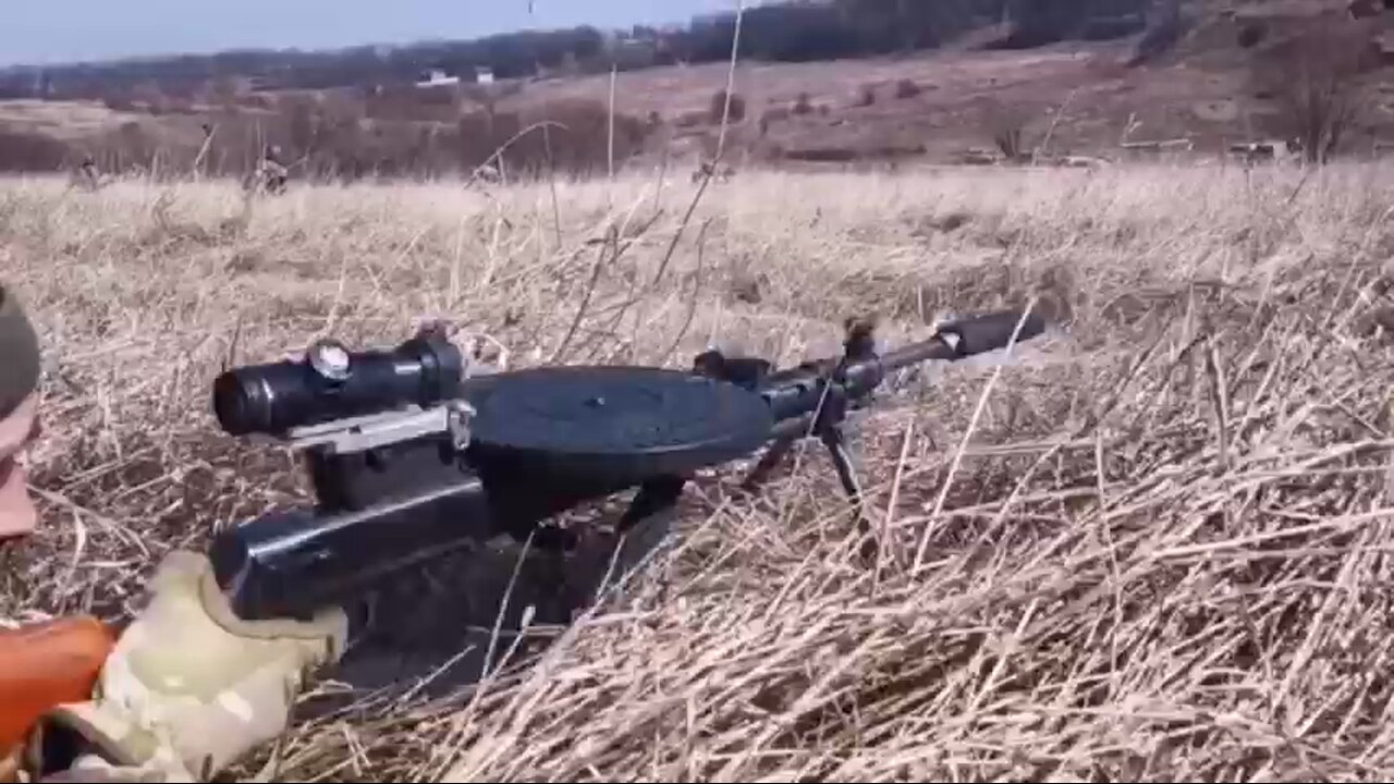 1927 Degtyarev DP-27 machine gun with modern optics and suppressor being used by a Ukrainian fighter