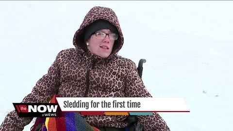 Canal Fulton police, fire band together so man with disabilities can go sledding for the first time