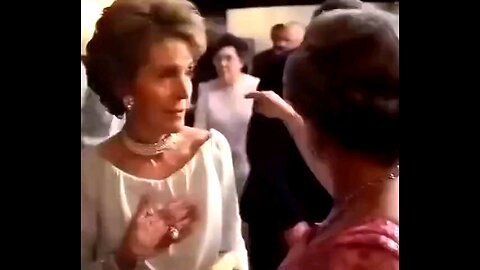 Queen Elizabeth II ordering coffee for Ronald and Nancy Reagan.