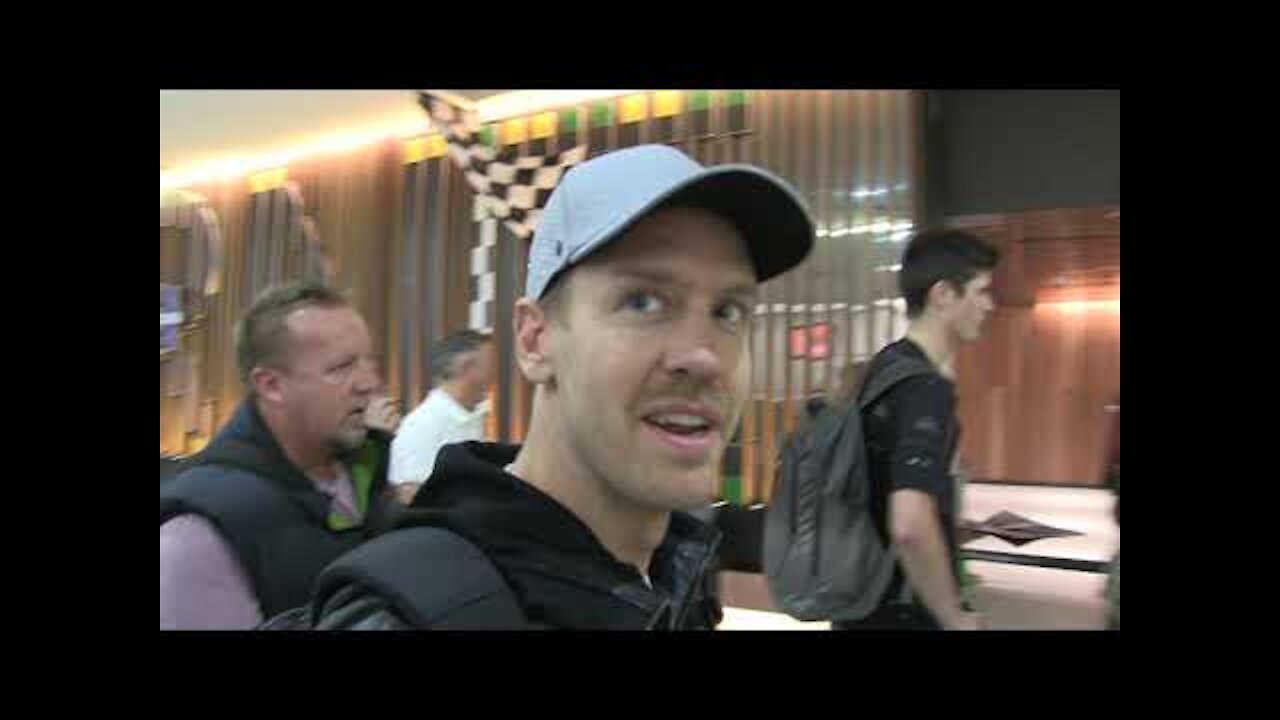 'Ferrari's Sebastian Vettel laughs with fans in Melbourne' |