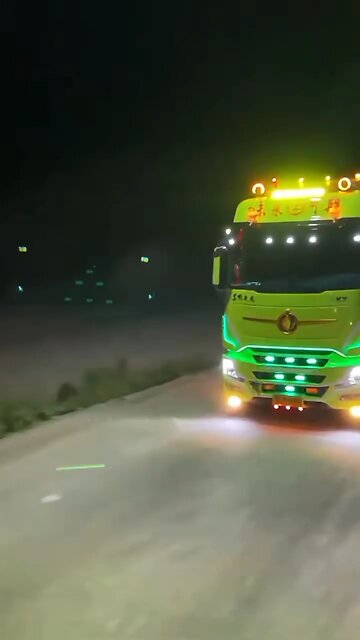 Impressive truck displaying vibrant lights on the highway🚦