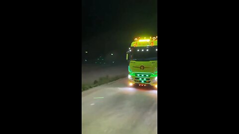 Impressive truck displaying vibrant lights on the highway🚦