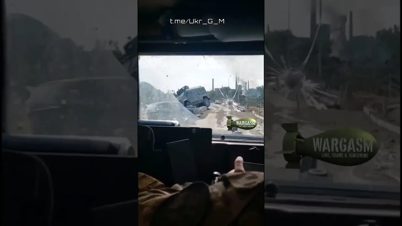 A road of destroyed vehicles somewhere in the conflict zone