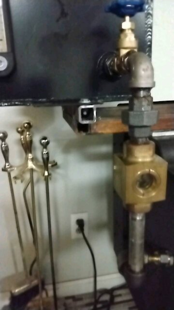 Waste oil burner in wood stove with flow sight glass