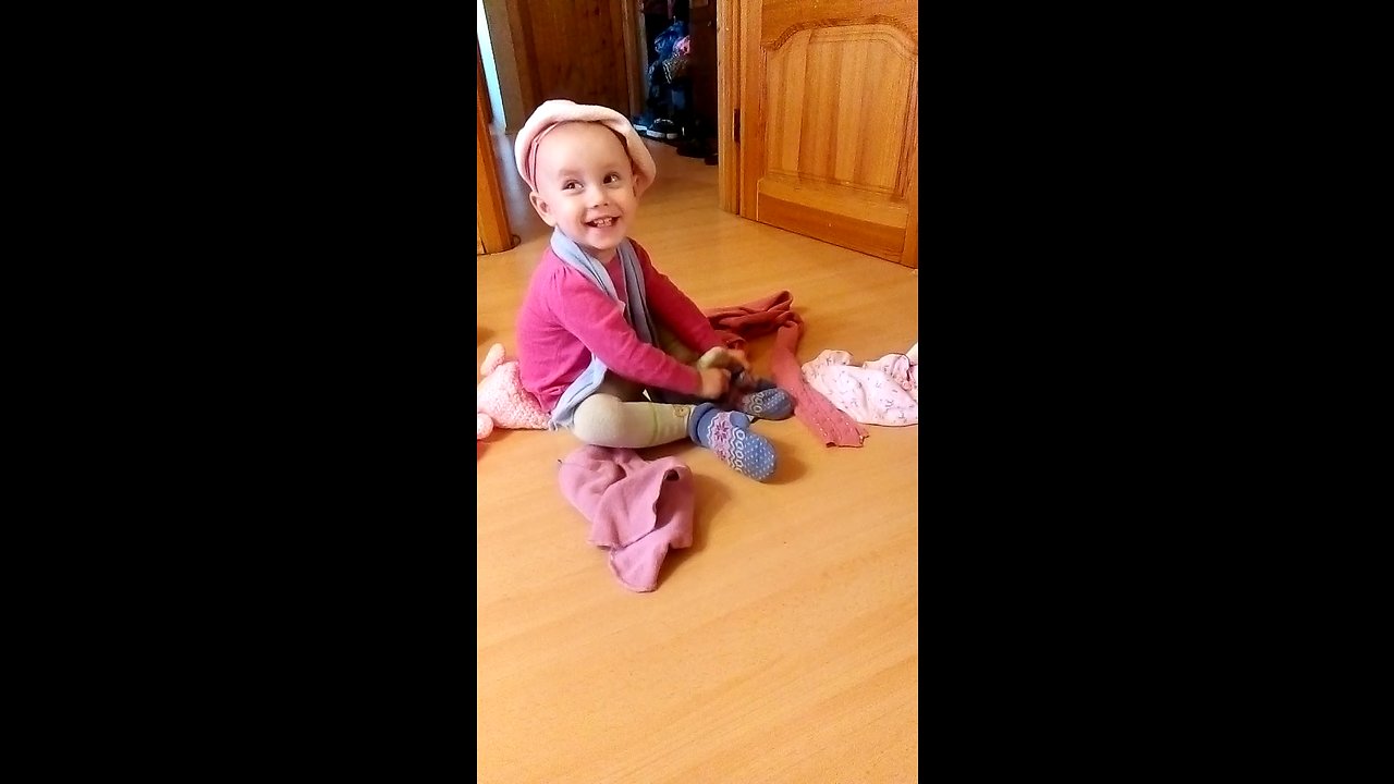 baby herself dressed for a walk