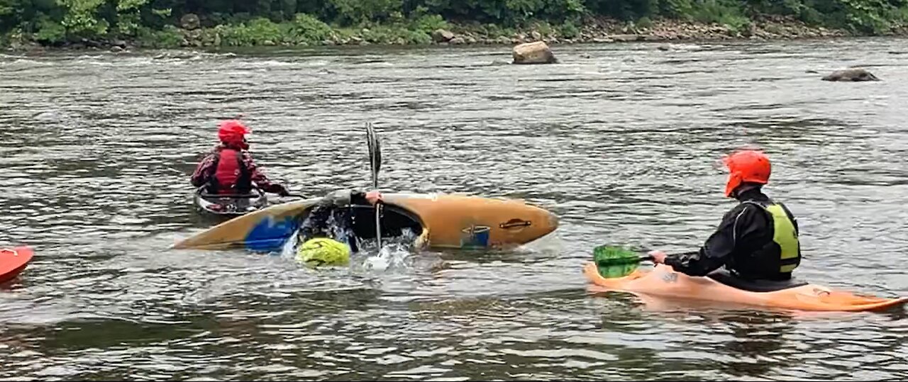 A Boat Rollover in White Water Rafting