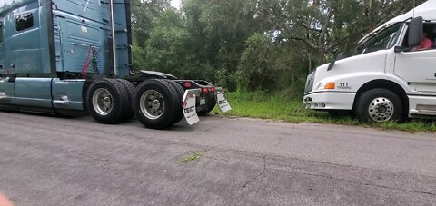 Volvo truck pulling out older Volvo