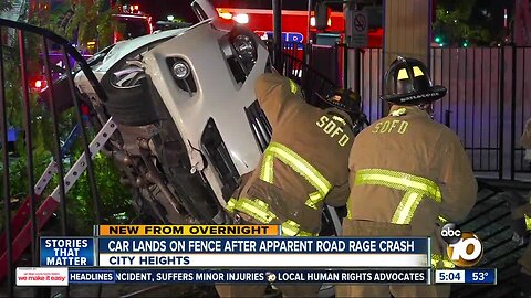 Car lands on fence in apparent road rage