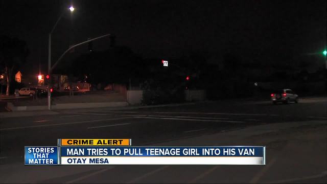 Police search for man accused of trying to force girl into van