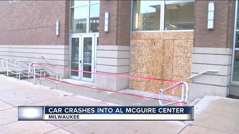 Man in custody after crashes car into McGuire Center