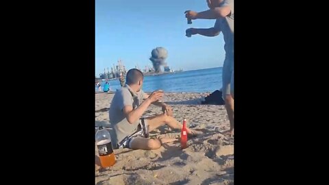 People at the beach while mines are being cleared at the port in Berdyansk, Ukraine