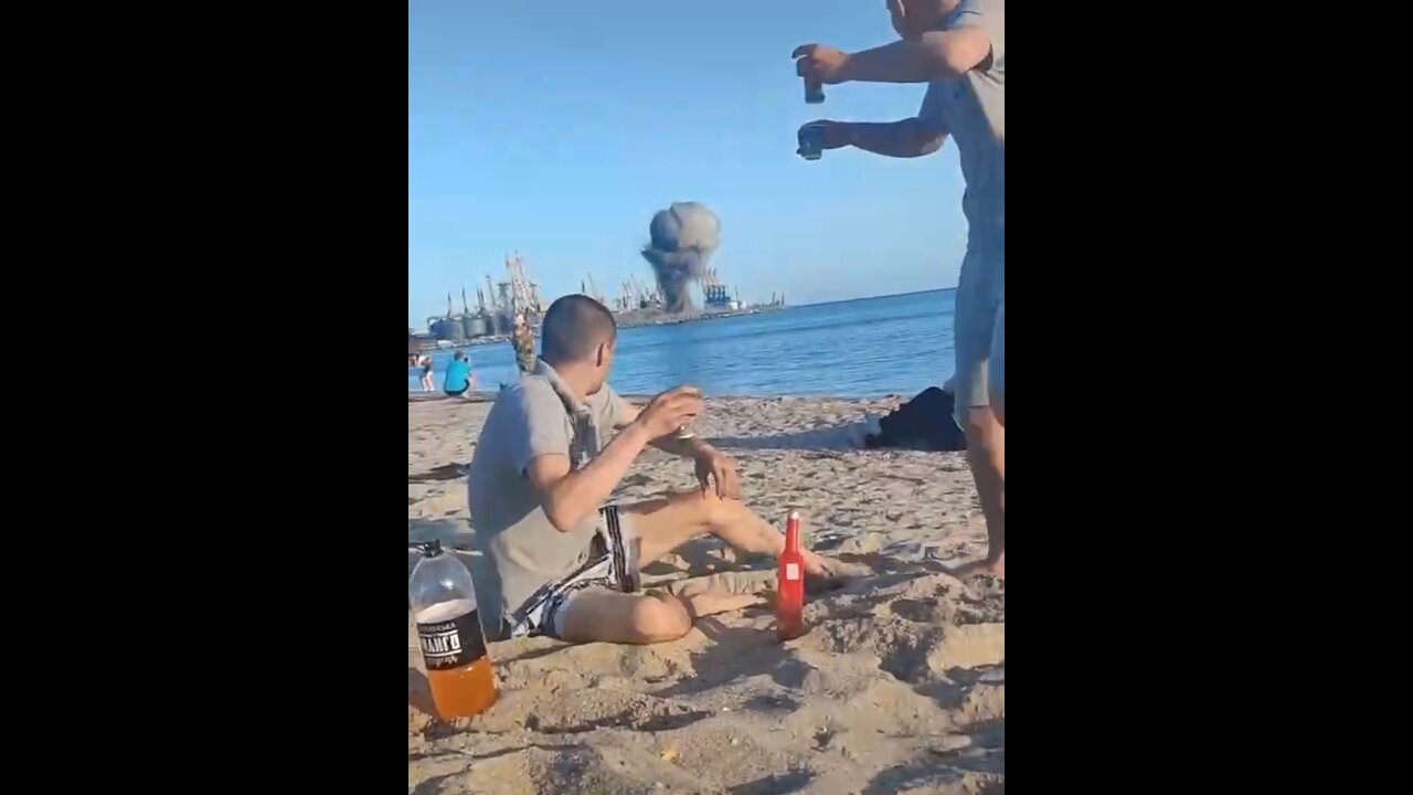 People at the beach while mines are being cleared at the port in Berdyansk, Ukraine
